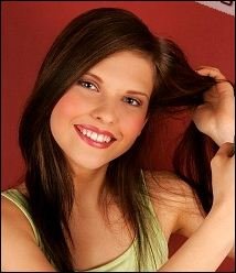 Young Woman Applying Hair Volluma